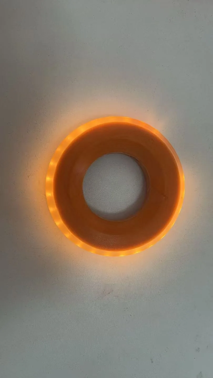 Close-up of the GLACILIT LED ringette ring with its LED beads lit